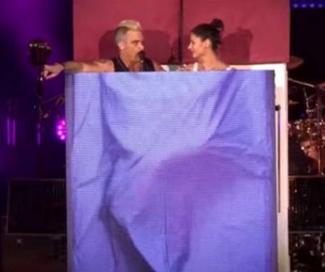 Ce face LUMI, fata pe care Robbie Williams a invitat-o pe scenă la concert