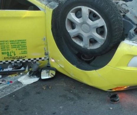 ACCIDENT SPECTACULOS în Capitală. Un TAXI s-a RĂSTURNAT